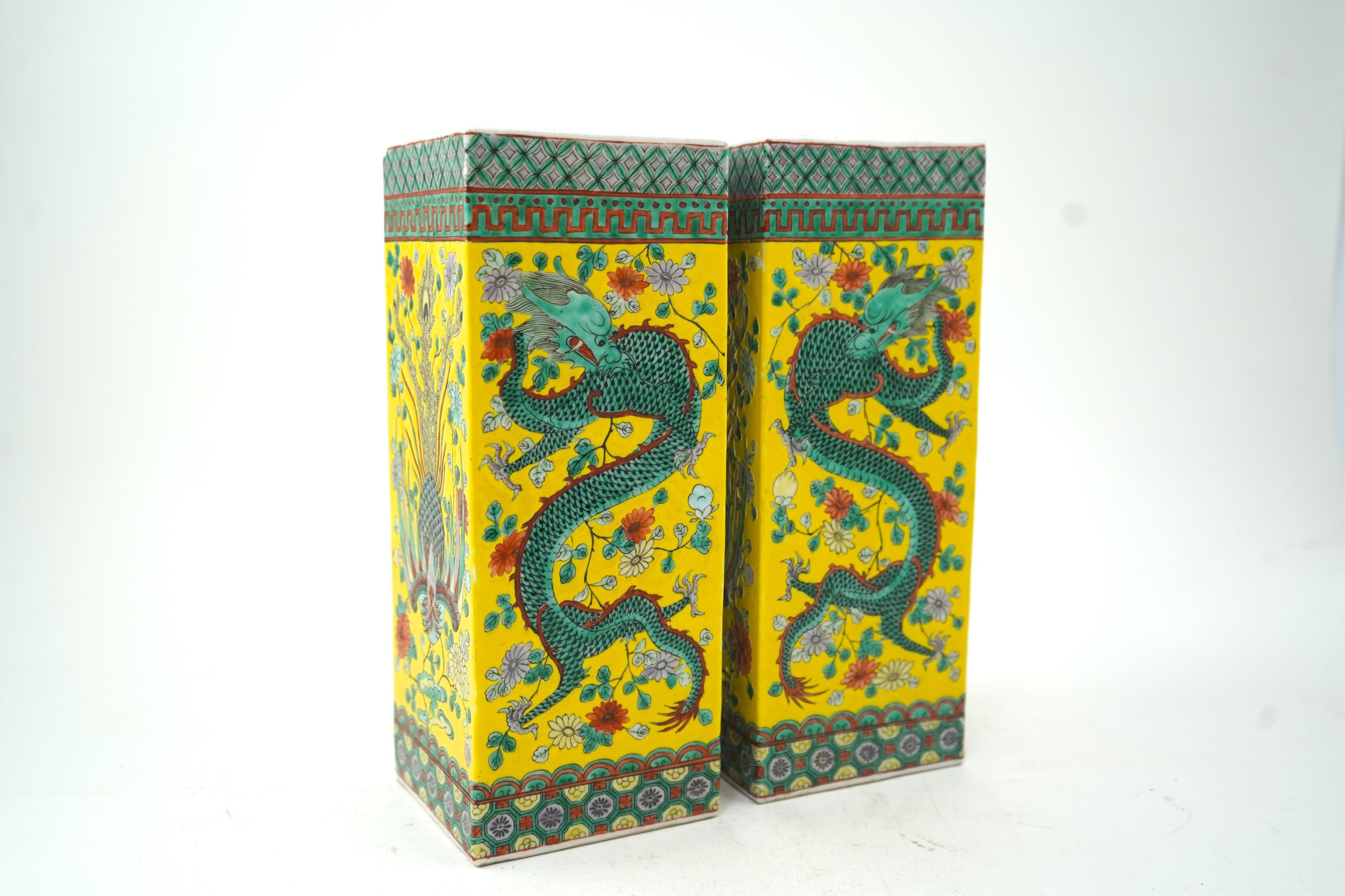 A pair of Chinese yellow ground square vases, late 19th century